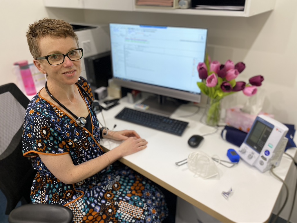 Dr Rachel McDonald seated at her desk
